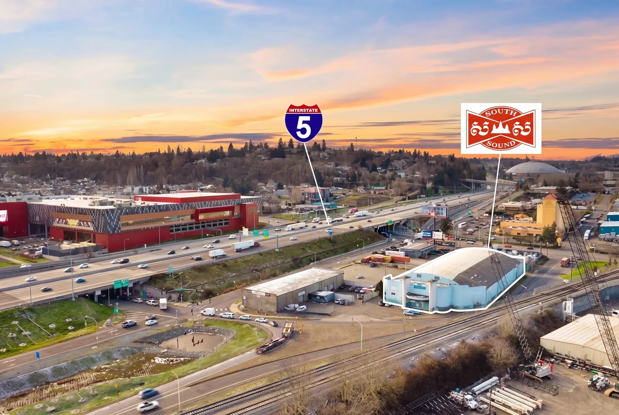 Aerial view of the Soccer Center beside Interstate 5 in Tacoma, with the Tacoma Dome in the distance