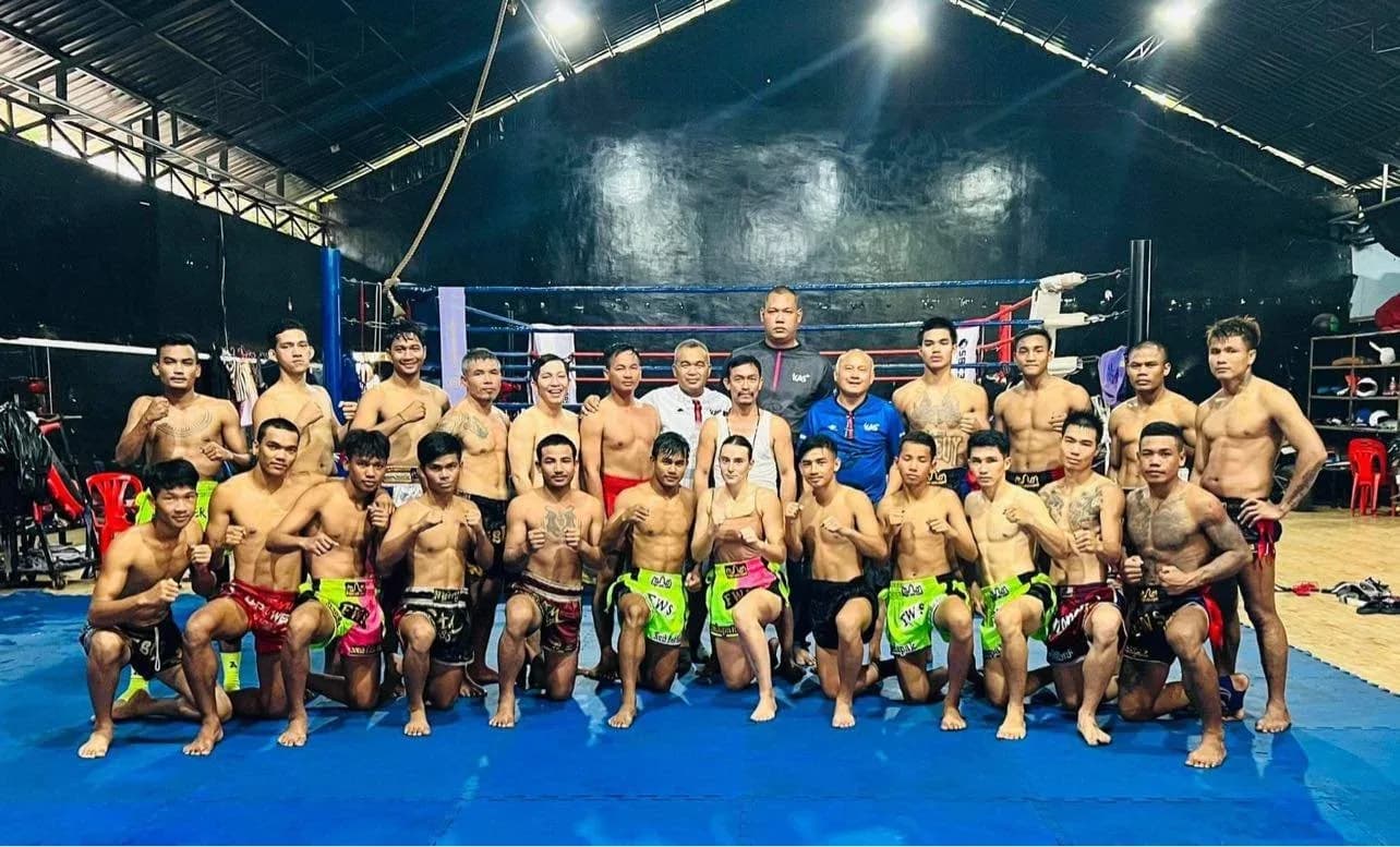 Kun Khmer fighters and coaches gathered in a gym in Cambodia