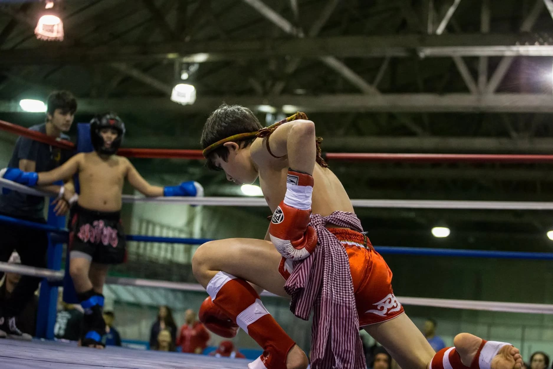 Two young fighters in the ring during a Kun Khmer bout